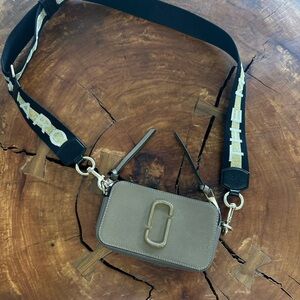 Marc Jacob’s Snapshot Designer Beige Crossbody Bag with Black & Gold Strap